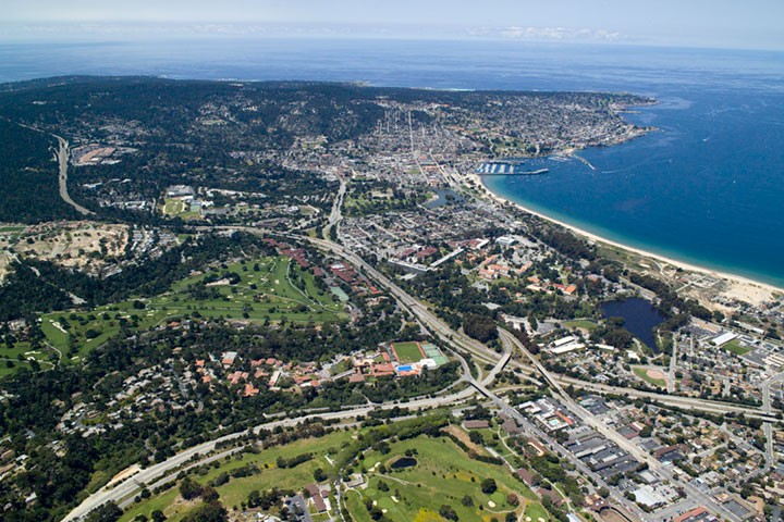 The Monterey waterfront, harbor, and blue waters of Monterey Bay, Monterey, California